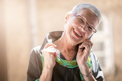 Optical Brand Emotional Story Telling Woman with new glasses on phone