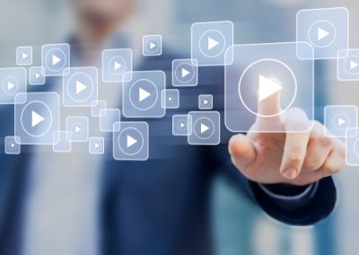 Man about to press video play, video marketing